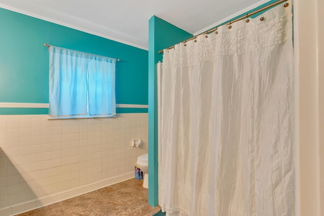 1615 Wilson Rd, Rossville, GA 30741 - full bathroom with tile walls, toilet, tile patterned floors, a wainscoted wall, and ornamental molding