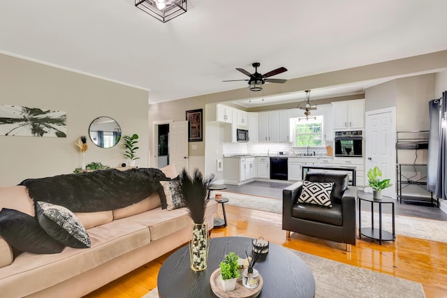 1615 Wilson Rd, Rossville, GA 30741 - living room with a ceiling fan, light wood finished floors, and crown molding