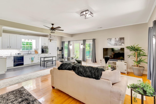 1615 Wilson Rd, Rossville, GA 30741 - living room with light wood-style floors, a ceiling fan, and ornamental molding