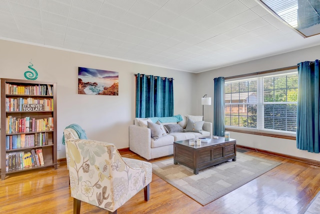 1615 Wilson Rd, Rossville, GA 30741 - living room with light wood-style floors, crown molding, and baseboards