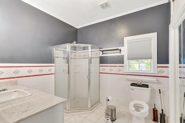 1615 Wilson Rd, Rossville, GA 30741 - full bathroom with tile walls, wainscoting, a stall shower, tile patterned floors, and crown molding