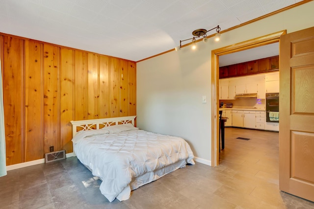 1615 Wilson Rd, Rossville, GA 30741 - bedroom featuring wood walls, ornamental molding, and baseboards