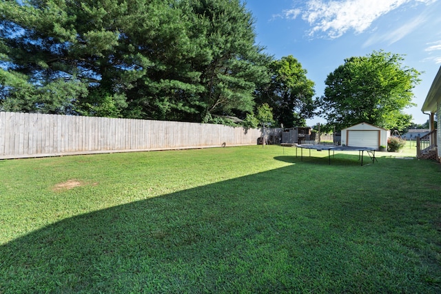 595 New Union Cir, Dayton, TN 37321 - view of yard featuring a trampoline and an outbuilding