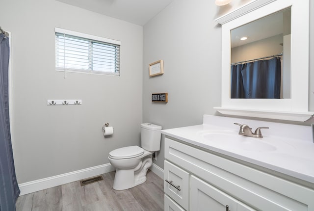 595 New Union Cir, Dayton, TN 37321 - full bathroom with vanity, baseboards, toilet, wood finished floors, and a shower with shower curtain
