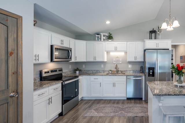 595 New Union Cir, Dayton, TN 37321 - kitchen featuring stainless steel appliances, a sink, dark wood finished floors, lofted ceiling, and white cabinets