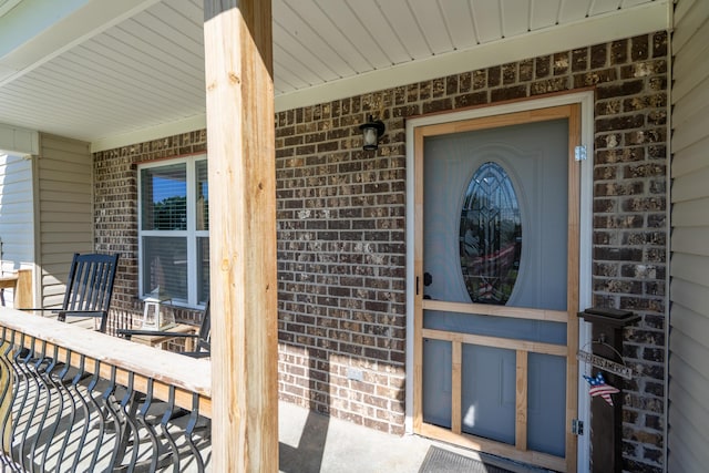 595 New Union Cir, Dayton, TN 37321 - doorway to property featuring covered porch and brick siding