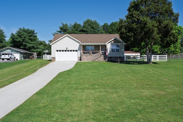 595 New Union Cir, Dayton, TN 37321 - view of front facade featuring a garage, driveway, and covered porch
