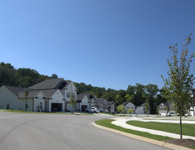 1681 Destiny Dr Unit 14, Hixson, TN 37343 - view of asphalt road with a residential view, sidewalks, and curbs