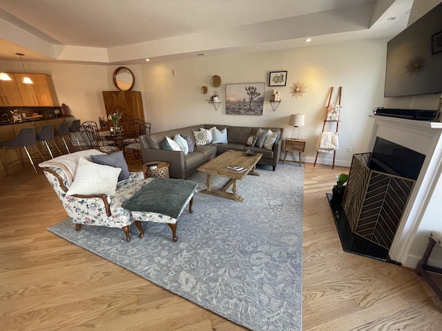 4 Cherokee Blvd Unit 306, Chattanooga, TN 37405 - living area with a raised ceiling, wood finished floors, recessed lighting, and a fireplace with flush hearth