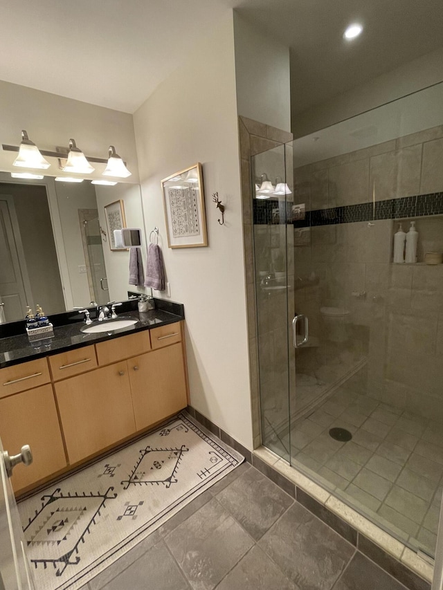4 Cherokee Blvd Unit 306, Chattanooga, TN 37405 - bathroom with vanity, a stall shower, baseboards, and recessed lighting