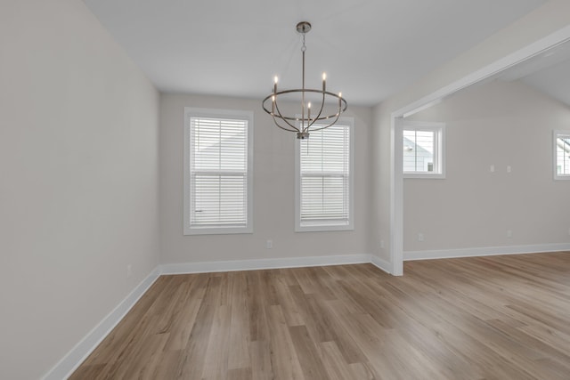 2592 Butlers Green Cir Unit 9, Chattanooga, TN 37421 - unfurnished room with a chandelier, light wood-style flooring, and baseboards