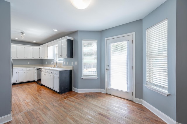7762 Lynnle Way, Hixson, TN 37343 - kitchen with dishwasher, light wood-type flooring, light countertops, healthy amount of natural light, and recessed lighting