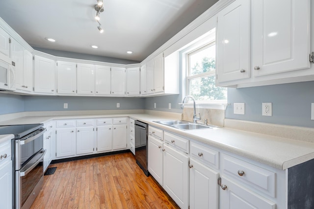 7762 Lynnle Way, Hixson, TN 37343 - kitchen with range with two ovens, dishwasher, light wood-style flooring, white cabinetry, and recessed lighting