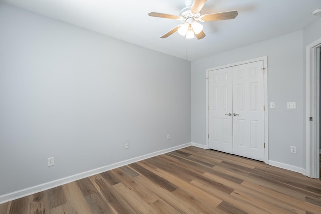 7762 Lynnle Way, Hixson, TN 37343 - unfurnished bedroom with wood finished floors, a closet, and ceiling fan