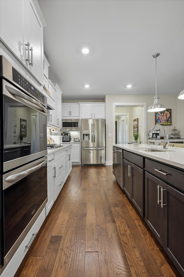 1590 Buttonwood Unit 20, Chattanooga, TN 37421 - kitchen featuring stainless steel appliances, light countertops, white cabinetry, dark wood-style flooring, and recessed lighting