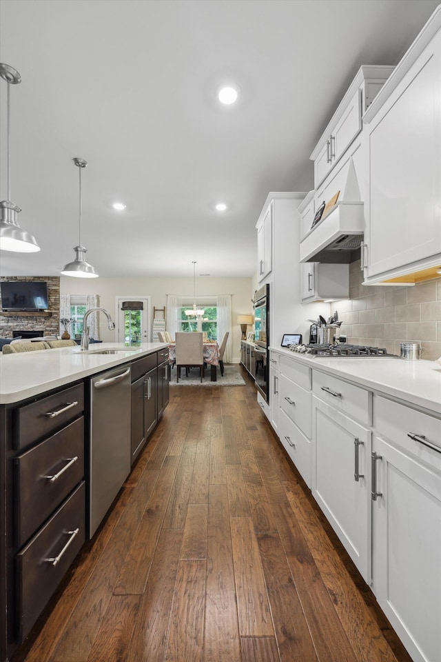 1590 Buttonwood Unit 20, Chattanooga, TN 37421 - kitchen featuring stainless steel appliances, a sink, dark wood finished floors, white cabinets, and light countertops