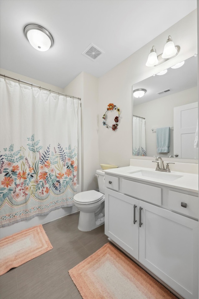 1590 Buttonwood Unit 20, Chattanooga, TN 37421 - full bathroom featuring toilet, vanity, curtained shower, and wood finished floors