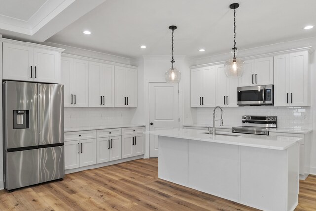 3563 Knollwood Hill Dr, Chattanooga, TN 37415 - kitchen with appliances with stainless steel finishes, backsplash, a sink, light countertops, and white cabinets