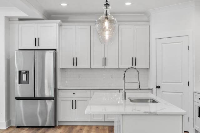 3563 Knollwood Hill Dr, Chattanooga, TN 37415 - kitchen featuring stainless steel fridge with ice dispenser, a sink, white cabinets, decorative light fixtures, and light stone countertops