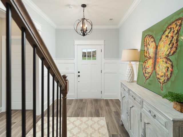 8868 Knolling Loop Unit 36, Ooltewah, TN 37363 - foyer with dark wood-style floors, a chandelier, ornamental molding, wainscoting, and a decorative wall