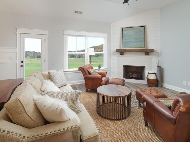 8868 Knolling Loop Unit 36, Ooltewah, TN 37363 - living area with light wood-type flooring, a ceiling fan, healthy amount of natural light, and a fireplace