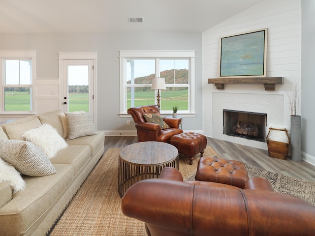 8868 Knolling Loop Unit 36, Ooltewah, TN 37363 - living room with wood finished floors, a large fireplace, lofted ceiling, and baseboards