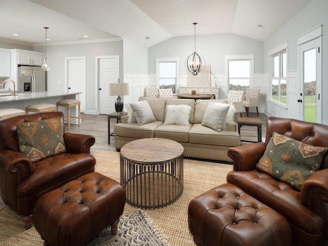 8868 Knolling Loop Unit 36, Ooltewah, TN 37363 - living room featuring a chandelier, wood finished floors, lofted ceiling, plenty of natural light, and ornamental molding