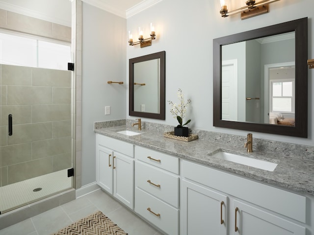 8868 Knolling Loop Unit 36, Ooltewah, TN 37363 - bathroom with double vanity, crown molding, a shower stall, tile patterned floors, and baseboards