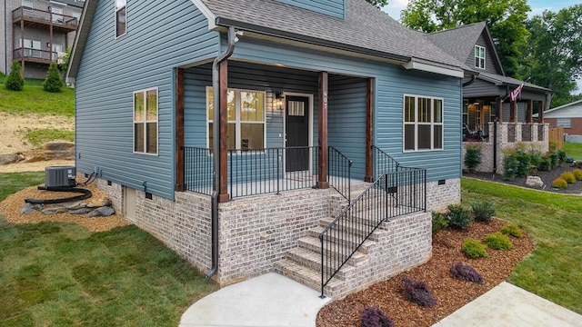 607 Westover Dr SW, Cleveland, TN 37311 - view of front facade with a shingled roof, a porch, central air condition unit, crawl space, and a front lawn