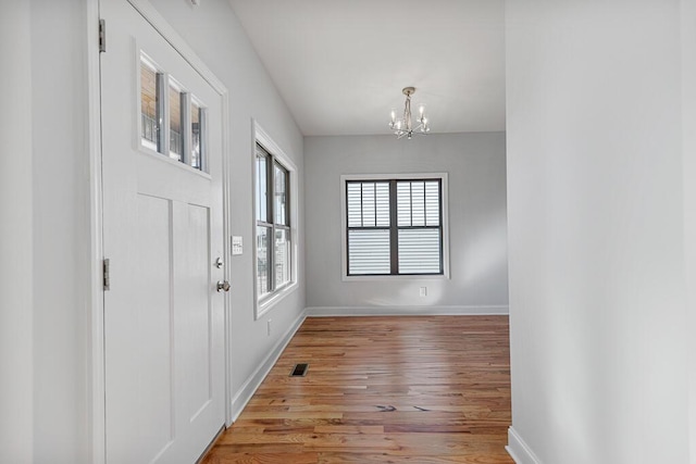607 Westover Dr SW, Cleveland, TN 37311 - foyer entrance with a chandelier, light wood-style flooring, and baseboards