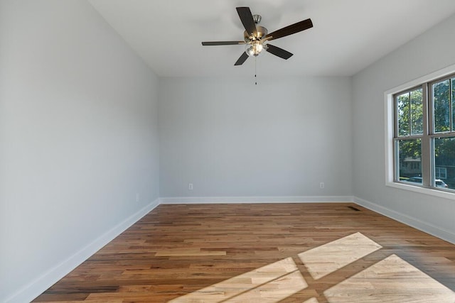 607 Westover Dr SW, Cleveland, TN 37311 - empty room featuring wood finished floors, baseboards, and a ceiling fan