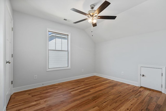 607 Westover Dr SW, Cleveland, TN 37311 - empty room featuring a ceiling fan, wood finished floors, vaulted ceiling, and baseboards