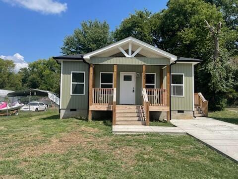 2105 Wisdom St, Chattanooga, TN 37406 - bungalow-style house with crawl space, a porch, and a front yard