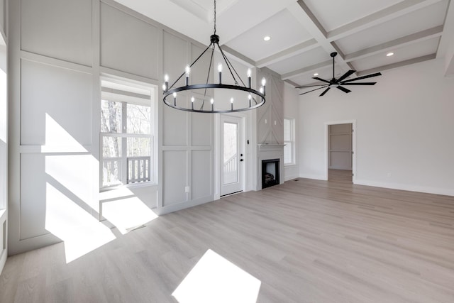 6221 Alexandra Pl, Chattanooga, TN 37416 - unfurnished living room with coffered ceiling, beamed ceiling, a chandelier, wood finished floors, and a decorative wall