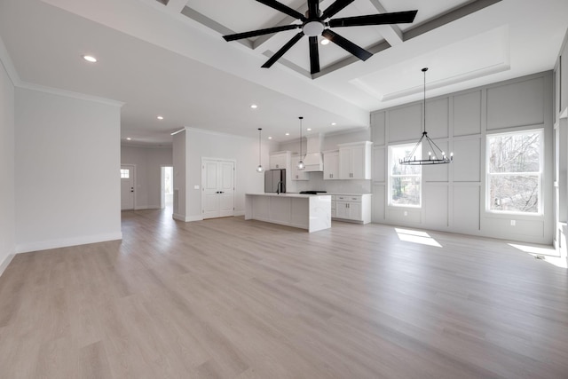 6221 Alexandra Pl, Chattanooga, TN 37416 - unfurnished living room featuring healthy amount of natural light, recessed lighting, a chandelier, ornamental molding, and ceiling fan
