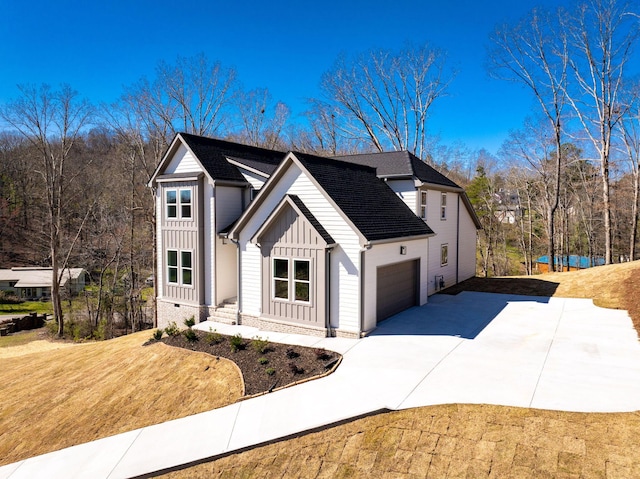 6221 Alexandra Pl, Chattanooga, TN 37416 - view of front of property featuring board and batten siding, driveway, and a garage