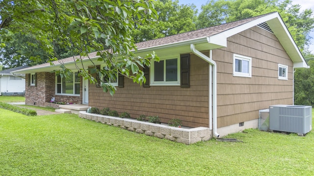 1331 Phils Dr, Chattanooga, TN 37421 - view of front of property with central air condition unit, crawl space, a front lawn, and a shingled roof