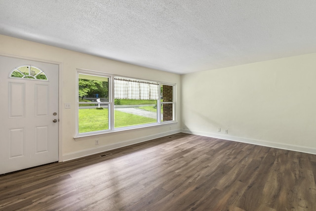 1331 Phils Dr, Chattanooga, TN 37421 - entryway with dark wood-style floors, a textured ceiling, and baseboards