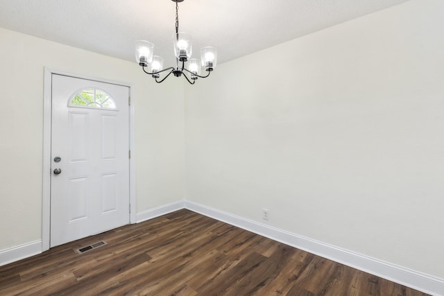 1331 Phils Dr, Chattanooga, TN 37421 - unfurnished dining area with a chandelier, dark wood finished floors, and baseboards