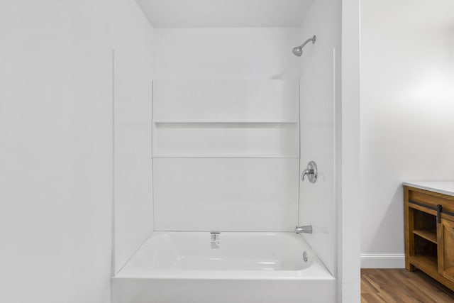 1331 Phils Dr, Chattanooga, TN 37421 - full bathroom featuring washtub / shower combination, vanity, wood finished floors, and baseboards