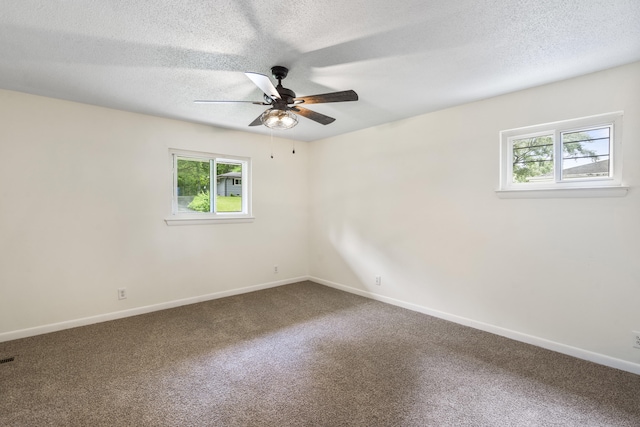 1331 Phils Dr, Chattanooga, TN 37421 - empty room featuring healthy amount of natural light, carpet floors, baseboards, and a textured ceiling