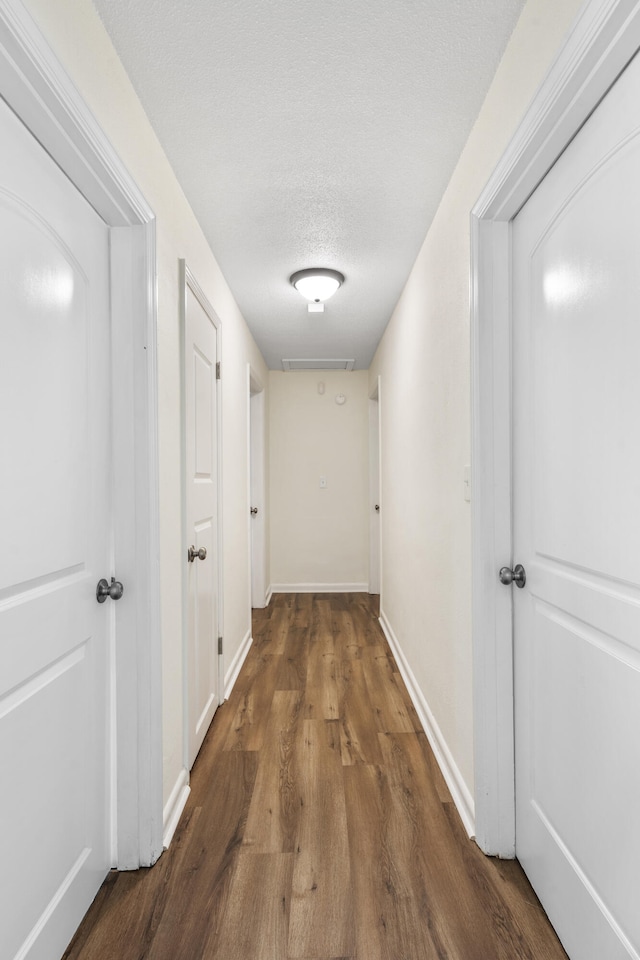 1331 Phils Dr, Chattanooga, TN 37421 - corridor with wood finished floors, baseboards, and a textured ceiling