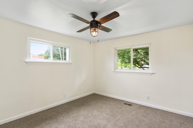 1331 Phils Dr, Chattanooga, TN 37421 - carpeted spare room featuring plenty of natural light, baseboards, and ceiling fan