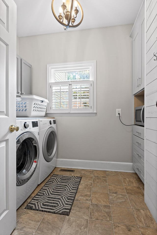 9334 Royal Mountain Dr, Chattanooga, TN 37421 - laundry area featuring cabinet space, independent washer and dryer, and a chandelier