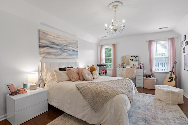 9334 Royal Mountain Dr, Chattanooga, TN 37421 - bedroom with lofted ceiling, wood finished floors, and a chandelier