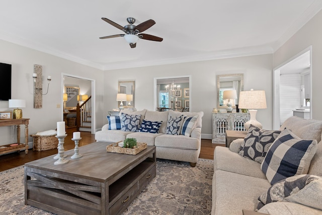9334 Royal Mountain Dr, Chattanooga, TN 37421 - living room with stairs, crown molding, wood finished floors, a ceiling fan, and a chandelier