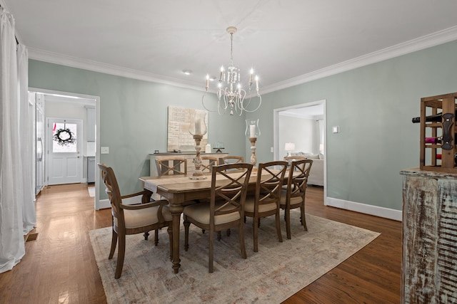 9334 Royal Mountain Dr, Chattanooga, TN 37421 - dining space featuring a chandelier, crown molding, and wood finished floors