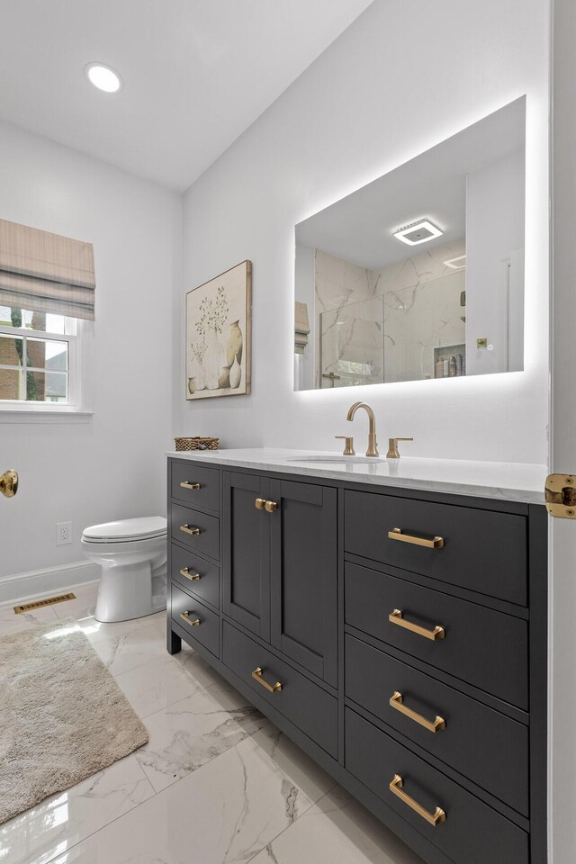 9334 Royal Mountain Dr, Chattanooga, TN 37421 - bathroom featuring vanity, marble look tile flooring, and a marble finish shower