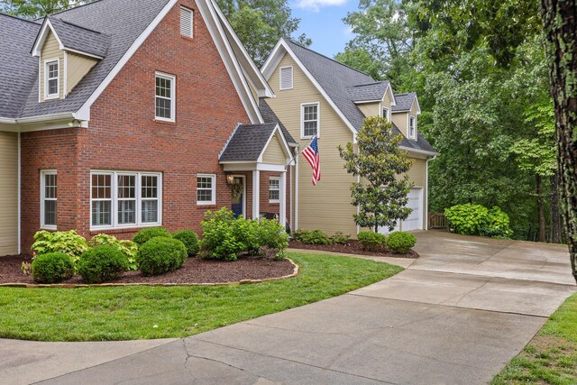 9334 Royal Mountain Dr, Chattanooga, TN 37421 - traditional-style home with driveway, brick siding, a garage, a front lawn, and a shingled roof