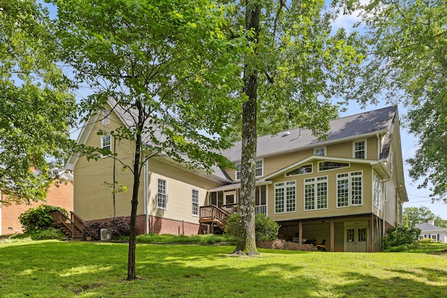 9334 Royal Mountain Dr, Chattanooga, TN 37421 - back of house with stairs, a lawn, a wooden deck, and a sunroom